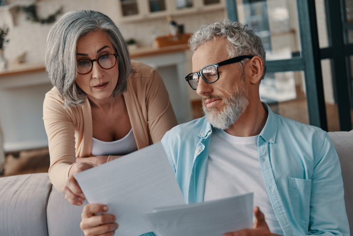 A couple deciding whether it makes sense to continue working after retirement.